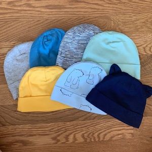 7 pack new Baby beanies - Size 0-6 months